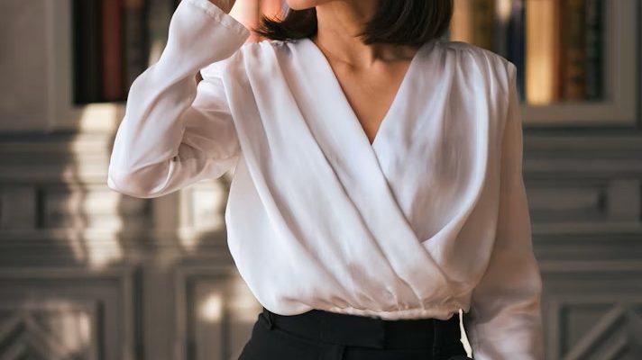 Confident woman standing in city street, symbolizing aging gracefully